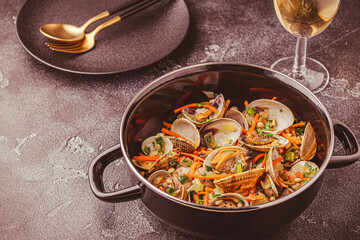 Shells vongole venus clams with vegetables and herbs