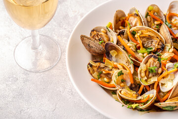 Shells vongole venus clams with vegetables and herbs