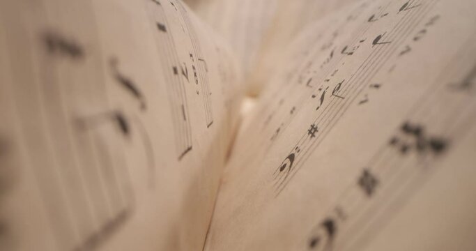 Vintage Sheet Music. Camera moving over a music sheet showing notes. Close up of music notes on a paper