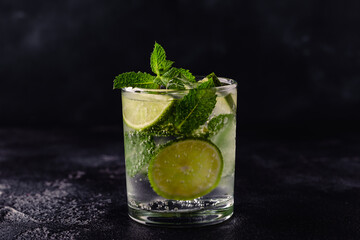 Refreshing summer alcoholic cocktail mojito with ice, fresh mint and lime