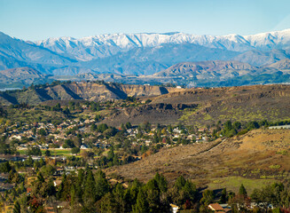 Panoramic  of Southern California valleys and mountains after the winter rains with homes in Conejo...