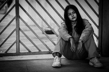 Fototapeta premium Portrait of women desperate to catch the iron prison,prisoner concept,thailand people,Hope to be free,If the violate the law would be arrested and jailed.