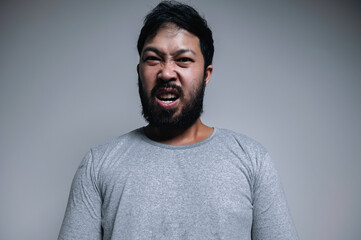 Asian handsome man angry on white background,Portrait of young Stress male concept