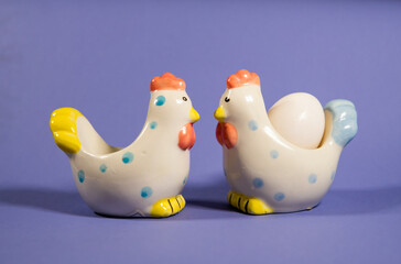 ceramic chicken on a purple background