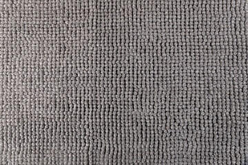 Gray chenille soft bath mat texture background. Bath Accessories. Top view.