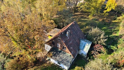 Private house among trees with yellowed leaves on the outskirts of the Latvian city of Riga on...