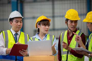  Warehouse worker meeting. Employee asian people using laptop in factory