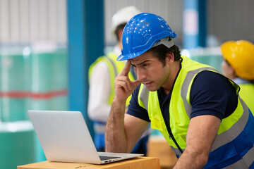  Warehouse worker online conference meeting. Employee asian people using laptop in factory