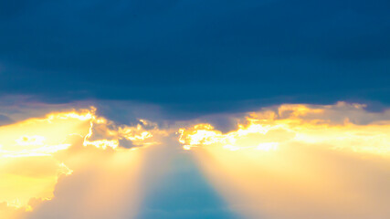 Fototapeta premium Dark stormy sky with the sun translucent