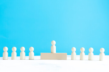 one wooden man figure on blue backgound