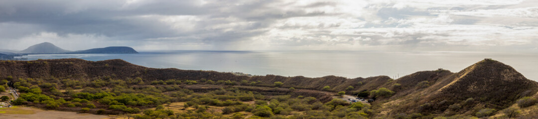 Aerial view of Honolulu, ocean, and foggy mountains from the summit of Diamond Head crater in Oahu, Hawaii