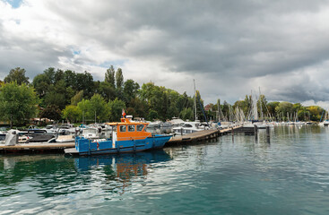 pier with boats on Lake Geneva in Yvoire