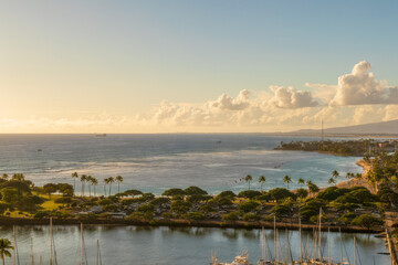 Scenic aerial view of Magic Island, Kahanamoku lagoon, marine, and Honolulu, Hawaii, the skyline from the top floor of the Waikiki building