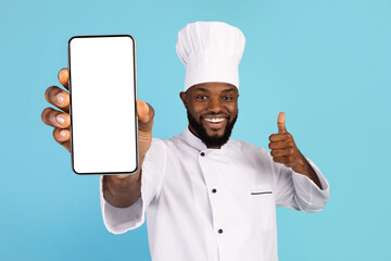 Happy African American Chef Holding Blank Smartphone And Showing Thumb Up
