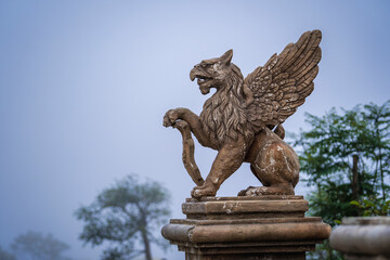 Gargoyle statue, chimeras, in the form of medieval winged monster, from the royal castle in Bana...