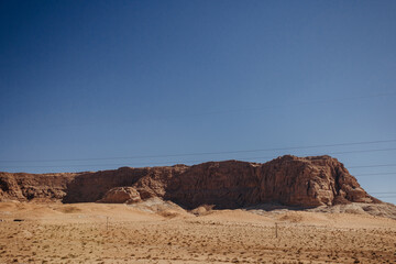 Fototapeta na wymiar A picturesque mountain in the desert. Wadi Rum desert with red sand. Desert landscape. Jordan