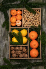 Fruits, nuts, spruce branch vitamin box.