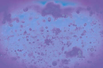 Background is purple with a bokeh effect. Effect of soap bubbles.