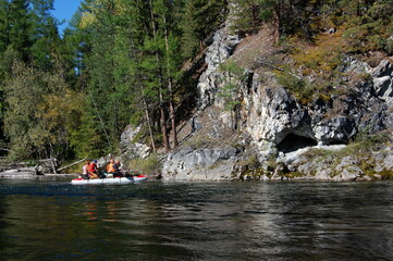 People rafting on a catamaran in the Sayan Mountains. Kyzyl-Khem river, Sayan Mountains, Russia.