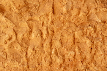 texture of a natural rough-cut stone of an ancient building