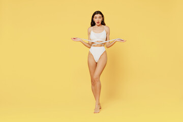 Full size young confused shocked wondered brunette woman 20s in white underwear with perfect fit...