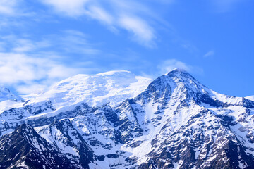 Clouds moving over Mont Blanc and the Aiguille du Gouter in Europe, France, the Alps, towards Chamonix, in summer, on a sunny day.
