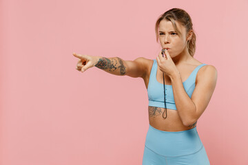 Young strong sporty athletic fitness trainer instructor woman wear blue tracksuit spend time in...