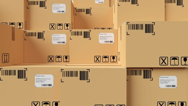 Left to right pan over huge stack of carton cardboard boxes background, freight, cargo, delivery or storage concept