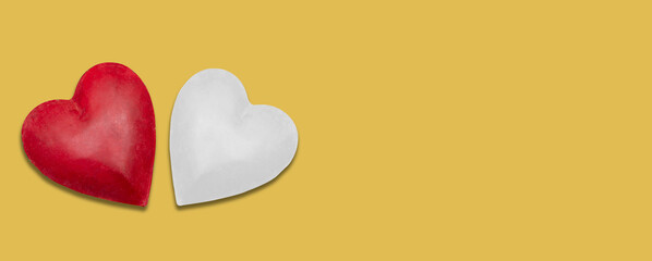Red and white heart shapes on yellow banner background