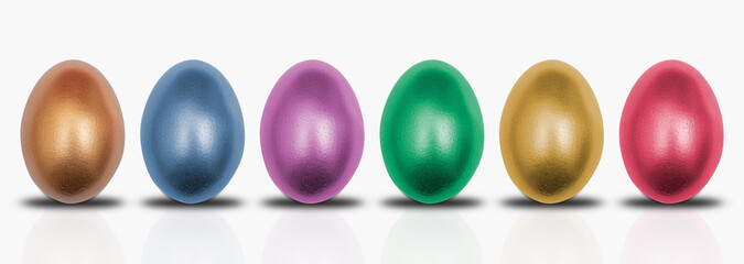 Different colored eggs on isolated white background