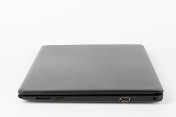 Modern, new office  black  laptop  on white background, side view. USB 2.0 port, vga port.