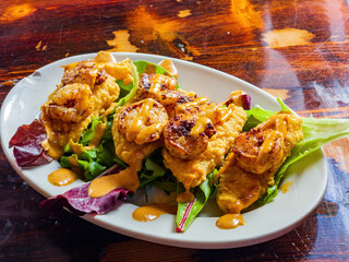 Close up shot of deep fried shrimp salad