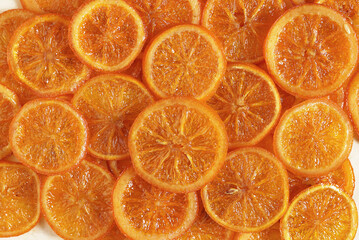 slices of orange candied fruits, close up. top view