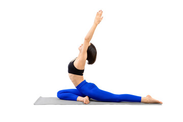 Fototapeta premium One-legged king pigeon pose with arms up. Beautiful fit woman in blue sportswear sitting on a mat and practice Hatha yoga, isolated on white.