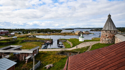 Fototapeta na wymiar Russia. Solovki. Solovetsky Islands. View from the White Tower to Prosperity Bay, Dry Dock and the Spinning Tower