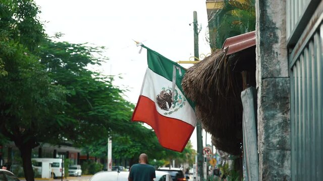 Flag of Mexico with fabric structure against a cloudy sky. Street viewHigh quality 4k footage