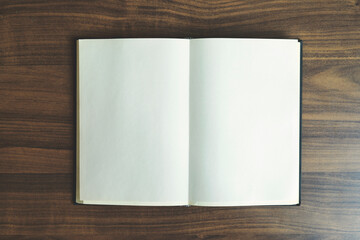 Open book on wooden background