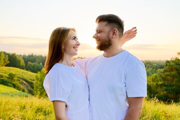 Outdoor portrait of adult happy loving hugging couple