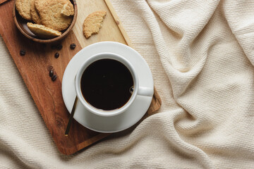 A cup of coffee with homemade cookies.