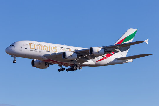 Emirates Airbus A380 landing in Vienna, Austria in beautiful morning light after flight from Dubai