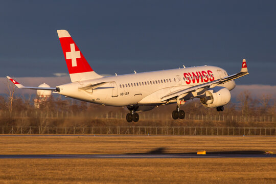 Swiss Airbus A220 landing in Vienna, Austria in beautiful morning light