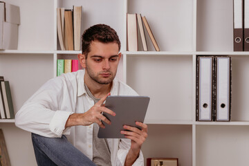 man at home with digital tablet or e-book