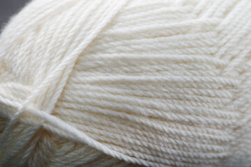 White threads of natural wool close-up in full screen