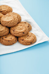 Oatmeal cookies on a napkin on a blue background
