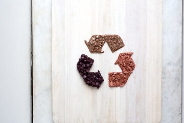 Recycle symbol made out of makeup