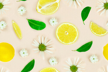 Seamless pattern of fresh chamomile flowers and lemon slice. Top view, flat lay, design element.