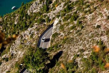 Aerial view of curve road with a car on the mountains. Croatia