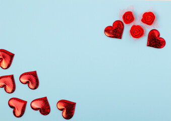 red hearts on a blue background with a place for the text, top view, Valentine's Day is the holiday of lovers.