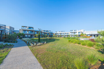 Fototapeta premium Beautiful view of exterior of Portes Lithos Luxury Resort hotel buildings. Greece. 