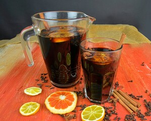 Christmas or New Year hot winter drink, spicy grog cocktail, sangria or mulled wine with tea,...